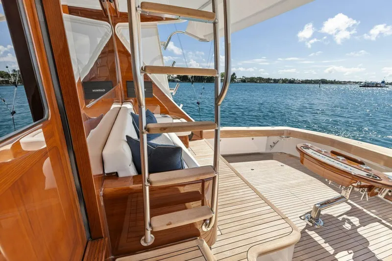 Team Harvey Yacht Photos Pics Luxurious 2026 Viking 82 Convertible yacht deck with wooden finish and ocean view.