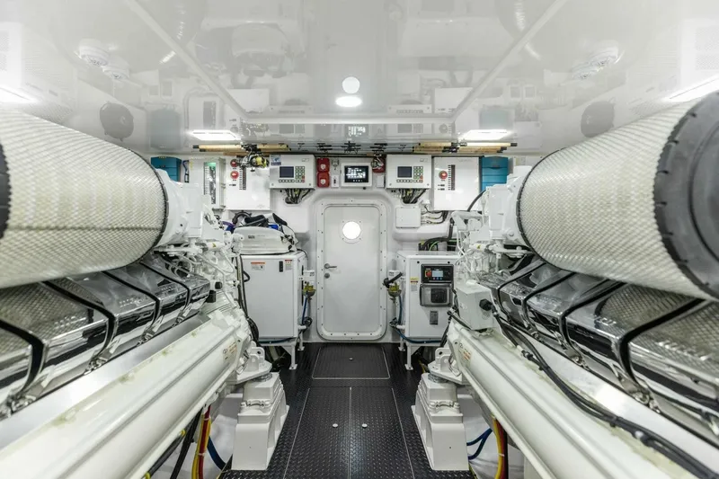 Team Harvey Yacht Photos Pics Engine room of 2026 Viking 82 Convertible yacht, showcasing advanced machinery and equipment.