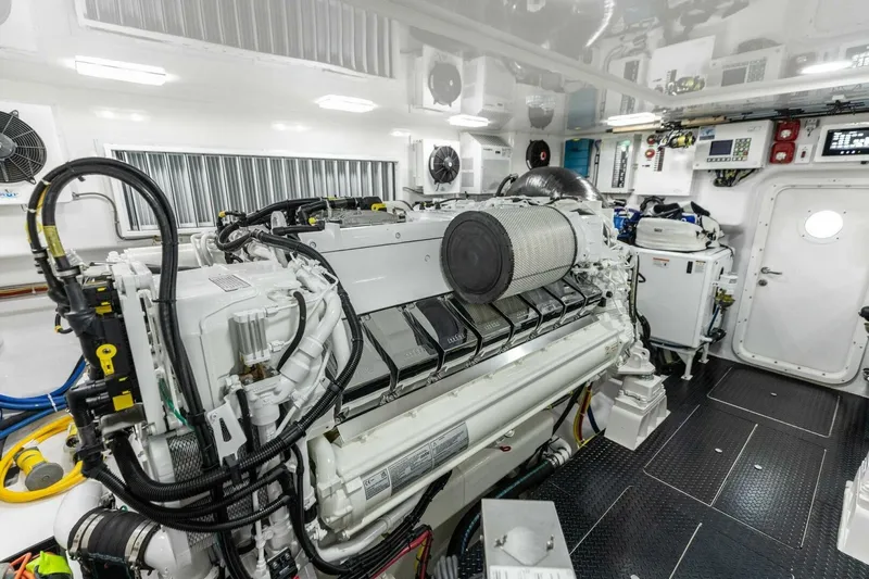 Team Harvey Yacht Photos Pics Engine room of 2026 Viking 82 Convertible yacht, showcasing advanced machinery and equipment.