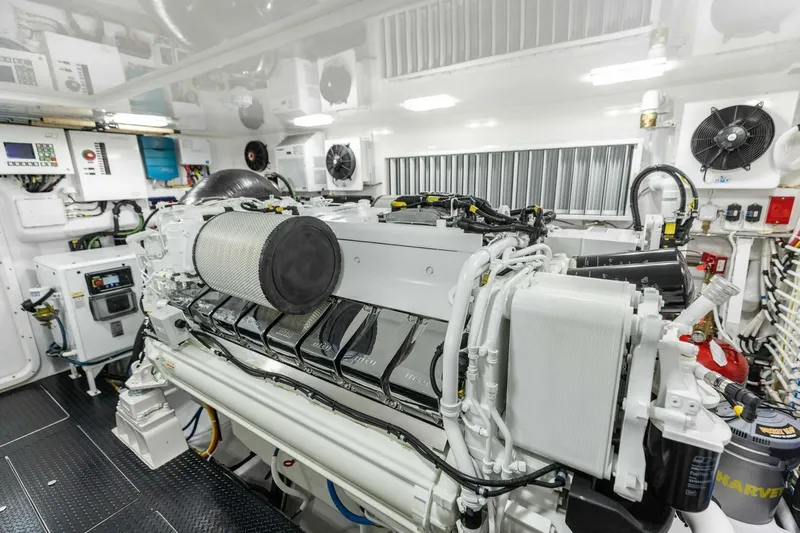 Team Harvey Yacht Photos Pics Engine room of 2026 Viking 82 Convertible yacht, showcasing advanced machinery and equipment.
