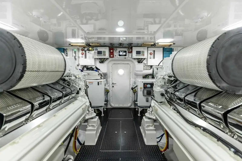 Team Harvey Yacht Photos Pics Engine room of 2026 Viking 82 Convertible yacht, showcasing advanced machinery and controls.