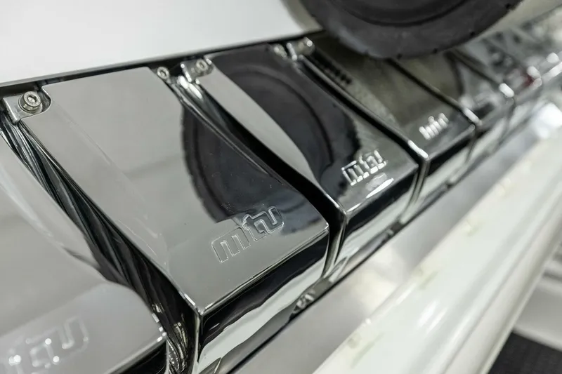 Team Harvey Yacht Photos Pics Chrome engine components of 2026 Viking 82 Convertible yacht, featuring MTU branding.