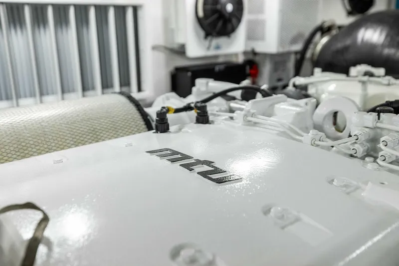 Team Harvey Yacht Photos Pics Engine room of 2026 Viking 82 Convertible yacht featuring MTU engine components.