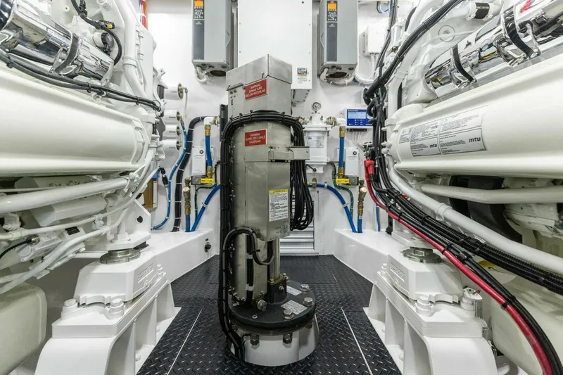 Team Harvey Yacht Photos Pics Engine room of 2026 Viking 82 Convertible yacht, showcasing advanced machinery and wiring.