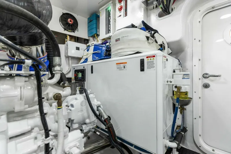 Team Harvey Yacht Photos Pics Engine room of 2026 Viking 82 Convertible yacht, showcasing advanced machinery and equipment.