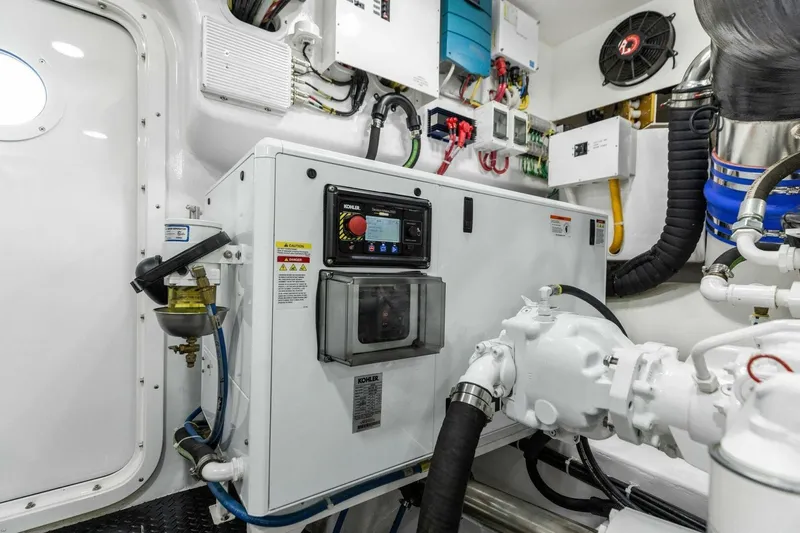 Team Harvey Yacht Photos Pics Engine room of 2026 Viking 82 Convertible yacht with advanced control systems and equipment.