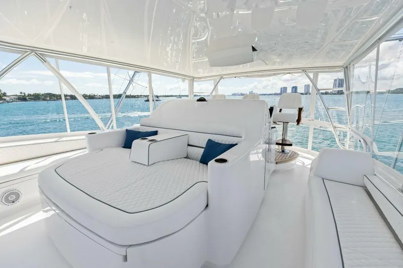 Team Harvey Yacht Photos Pics Luxurious interior of 2026 Viking 82 Convertible yacht with plush seating and ocean view.