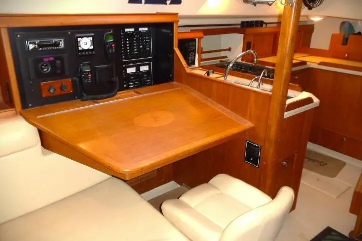 Epithelios Yacht Photos Pics Interior of 2002 Island Packet 420 sailboat with navigation station and galley.