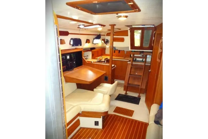 Epithelios Yacht Photos Pics Interior of 2002 Island Packet 420 yacht with wood finish and comfortable seating.