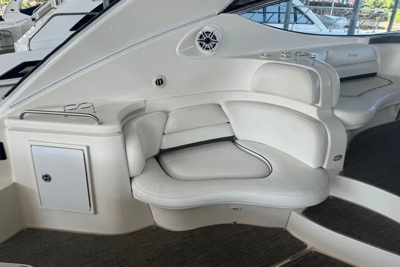  Yacht Photos Pics 2006 Cruisers Yachts 560 Express interior seating with white leather upholstery and modern design.