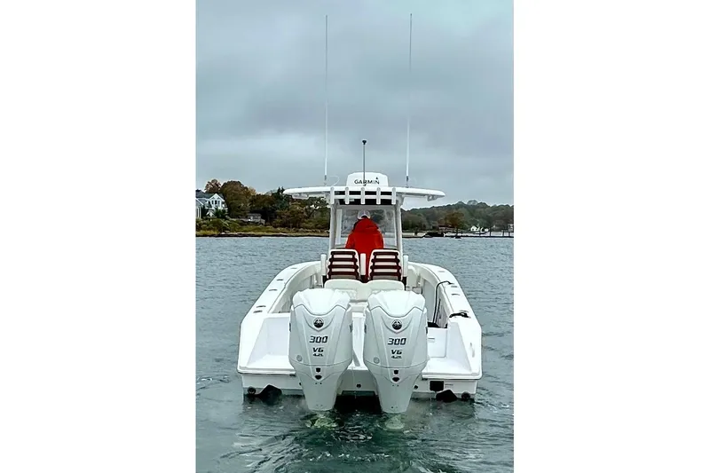 Changes In Lattitudes Yacht Photos Pics 2023 Jupiter 30 boat with dual 300 V6 engines on a cloudy day.