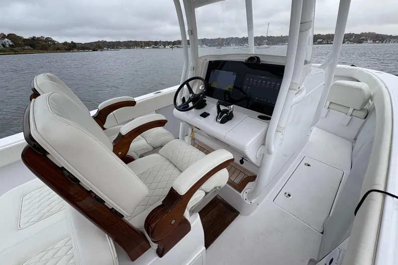Changes In Lattitudes Yacht Photos Pics Interior of 2023 Jupiter 30 boat with luxurious seating and advanced navigation system.