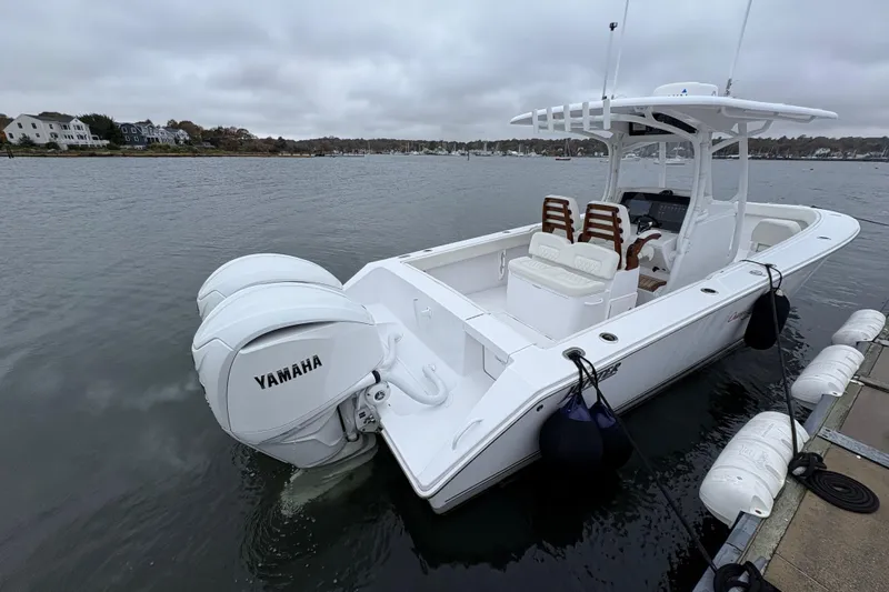 Changes In Lattitudes Yacht Photos Pics 2023 Jupiter 30 boat with Yamaha engines docked on a cloudy day.