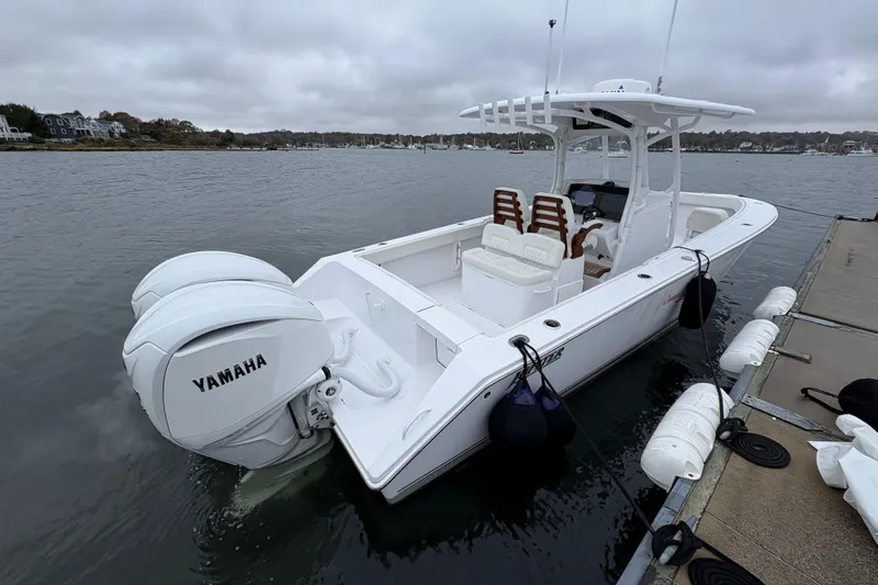 Changes In Lattitudes Yacht Photos Pics 2023 Jupiter 30 boat docked with twin Yamaha engines, overcast sky.