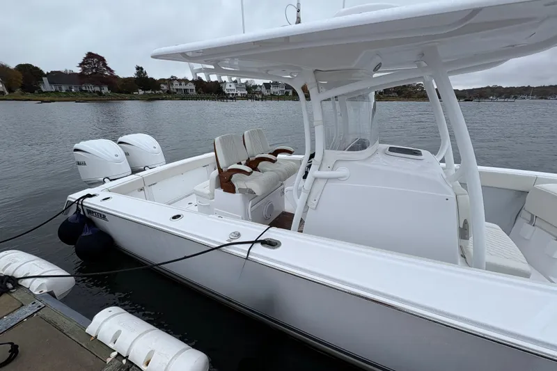 Changes In Lattitudes Yacht Photos Pics 2023 Jupiter 30 boat docked, featuring dual Yamaha engines and sleek white design.