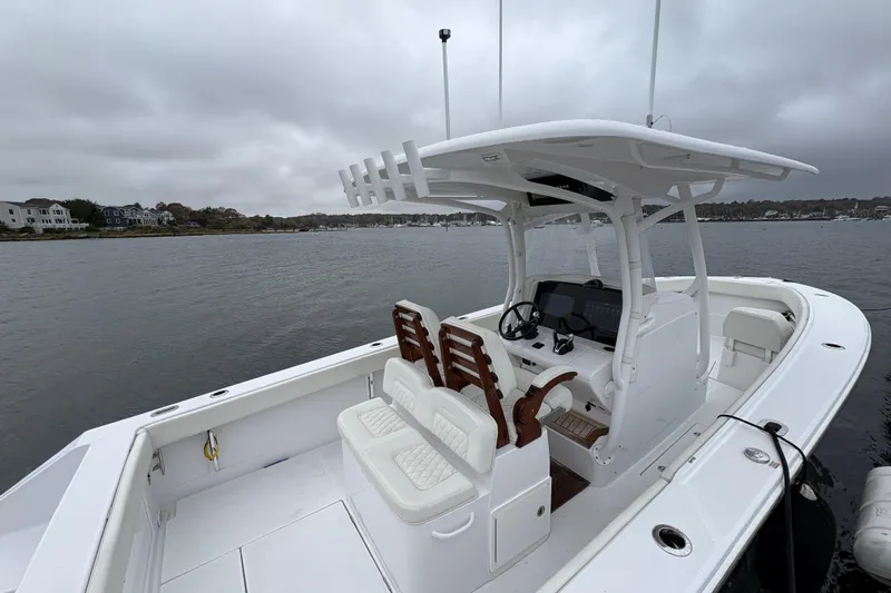 Changes In Lattitudes Yacht Photos Pics 2023 Jupiter 30 boat with dual seats and console on a cloudy day.