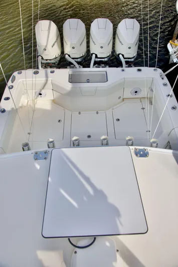  Yacht Photos Pics 2024 SeaVee 390Z boat with four powerful outboard engines, spacious deck layout.