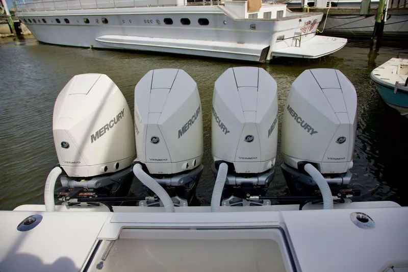  Yacht Photos Pics Four Mercury outboard engines on a 2024 SeaVee 390Z boat, docked in a marina.