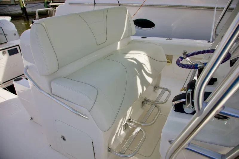  Yacht Photos Pics 2024 SeaVee 390Z boat seating area with white upholstery and stainless steel footrests.