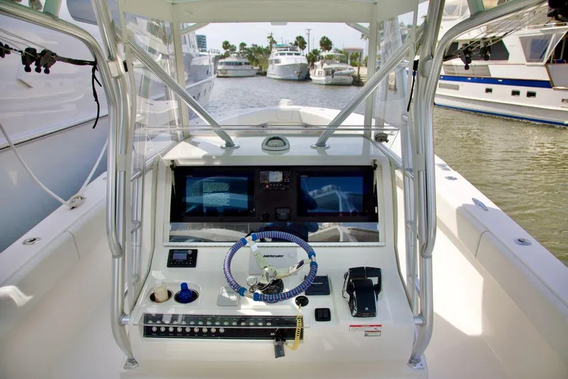  Yacht Photos Pics 2024 SeaVee 390Z boat cockpit with advanced navigation system and steering wheel.