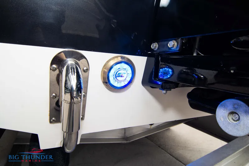  Yacht Photos Pics Close-up of 2020 Donzi 38 ZRC boat stern with blue LED lights.