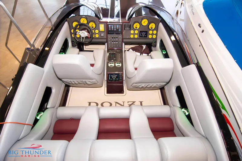 Yacht Photos Pics Interior of a 2020 Donzi 38 ZRC speedboat with dual helm and plush seating.