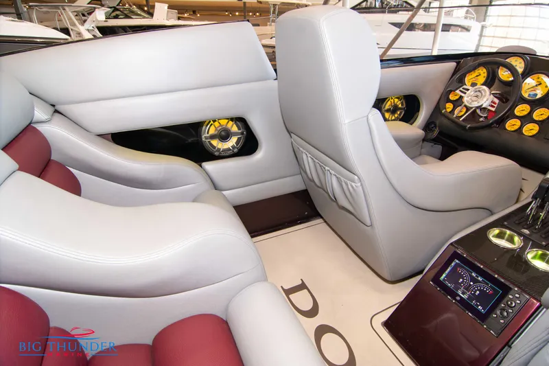  Yacht Photos Pics Interior of a 2020 Donzi 38 ZRC speedboat with luxurious seating and advanced dashboard.