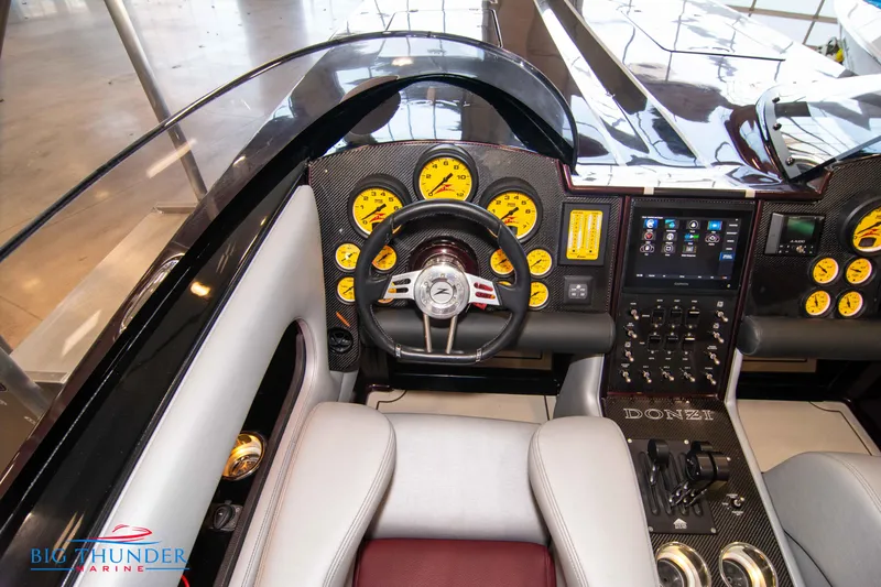  Yacht Photos Pics Cockpit of a 2020 Donzi 38 ZRC powerboat with advanced controls and gauges.