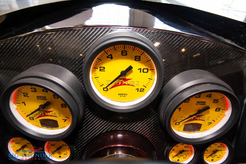  Yacht Photos Pics Dashboard of a 2020 Donzi 38 ZRC with yellow gauges.