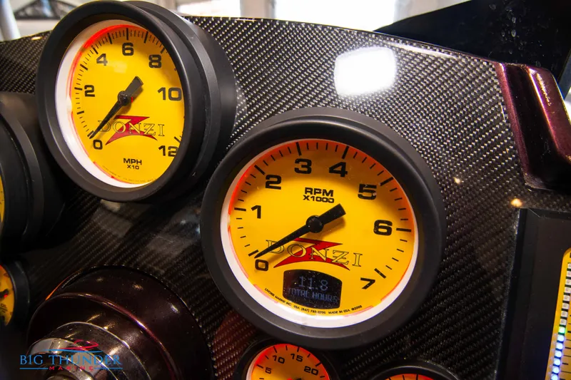  Yacht Photos Pics Close-up of 2020 Donzi 38 ZRC dashboard with yellow RPM and speed gauges.