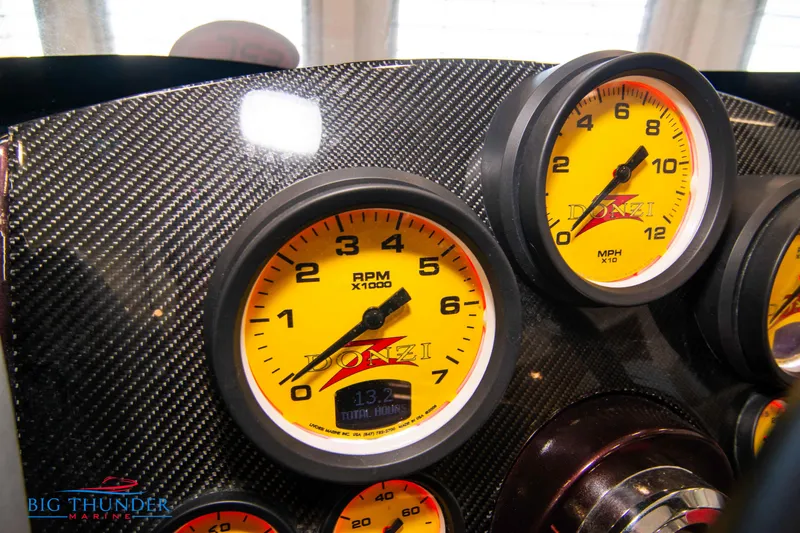  Yacht Photos Pics Close-up of 2020 Donzi 38 ZRC dashboard with yellow RPM and MPH gauges.