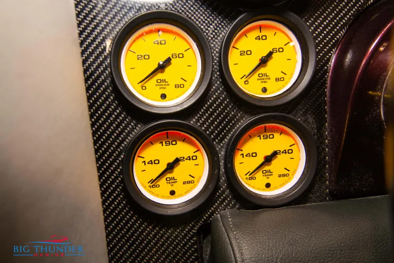  Yacht Photos Pics Close-up of oil pressure and temperature gauges on a 2020 Donzi 38 ZRC boat dashboard.