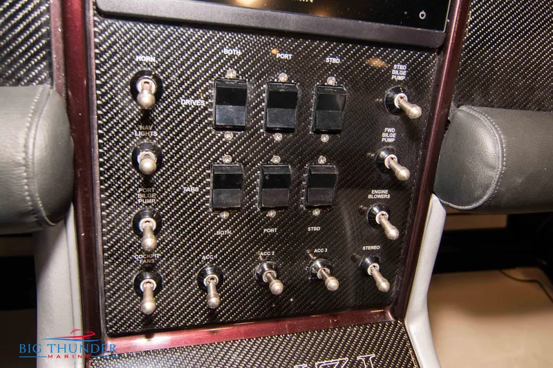  Yacht Photos Pics Control panel of a 2020 Donzi 38 ZRC boat with carbon fiber finish.
