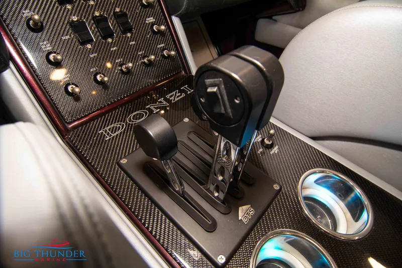  Yacht Photos Pics 2020 Donzi 38 ZRC boat control panel with carbon fiber finish and dual throttle levers.