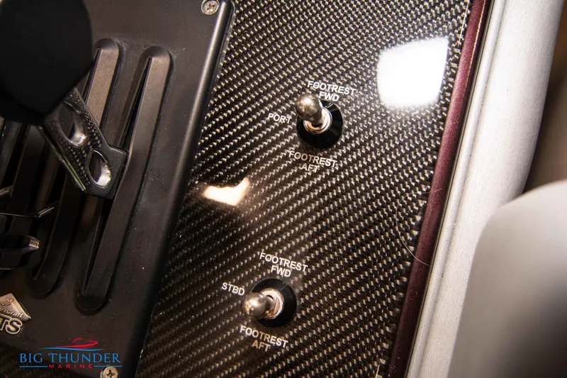  Yacht Photos Pics Carbon fiber control panel of 2020 Donzi 38 ZRC boat with footrest switches.