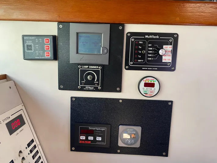 Foxy Yacht Photos Pics Control panel with various gauges and displays on a 1995 Sundeer 56 yacht.