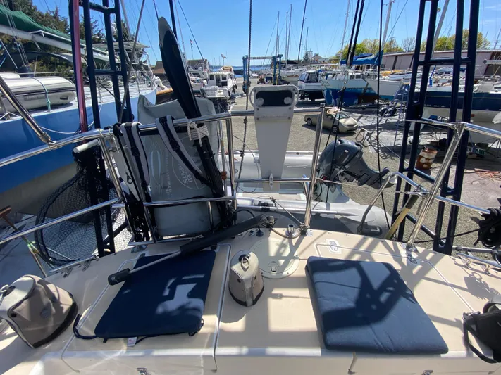 Foxy Yacht Photos Pics Sundeer 56 sailboat deck, 1995 model, with seating and equipment, docked in a marina.