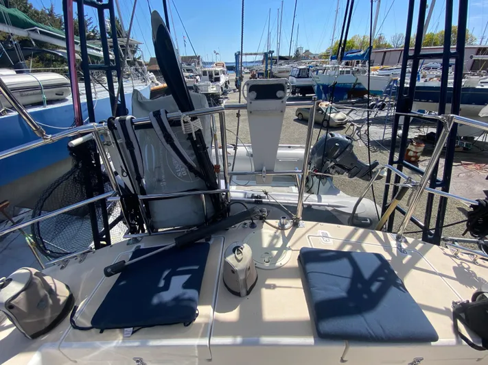 Foxy Yacht Photos Pics Sundeer 56 sailboat deck, 1995 model, with seating and equipment, docked in a marina.