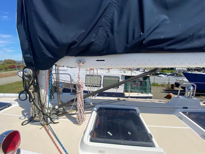 Foxy Yacht Photos Pics Sundeer 56 sailboat deck with ropes and covered boom, 1995 model.