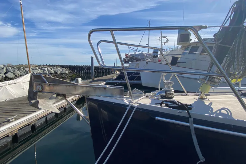 Foxy Yacht Photos Pics Sundeer 56 sailboat from 1995 docked, featuring anchor and deck equipment.