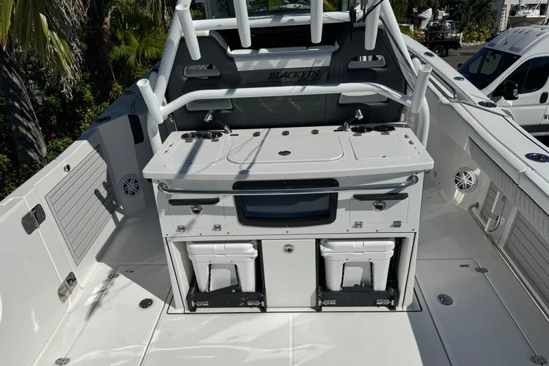  Yacht Photos Pics 2021 Blackfin 332 CC boat interior with fishing station and storage compartments.