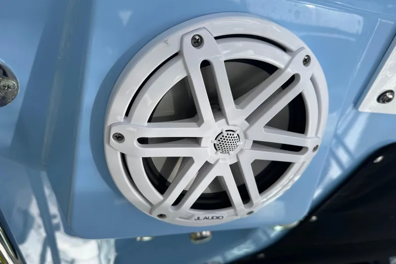  Yacht Photos Pics White JL Audio speaker on 2021 Blackfin 332 CC boat, mounted on a blue surface.