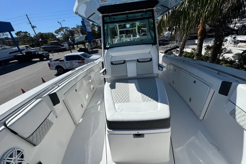  Yacht Photos Pics 2021 Blackfin 332 CC boat interior with white seating and storage compartments.