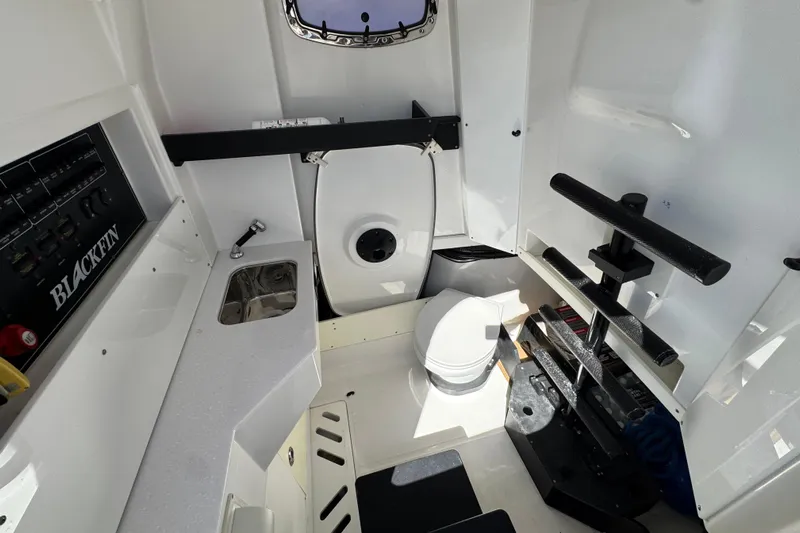  Yacht Photos Pics Interior of 2021 Blackfin 332 CC boat featuring a compact bathroom and sink area.