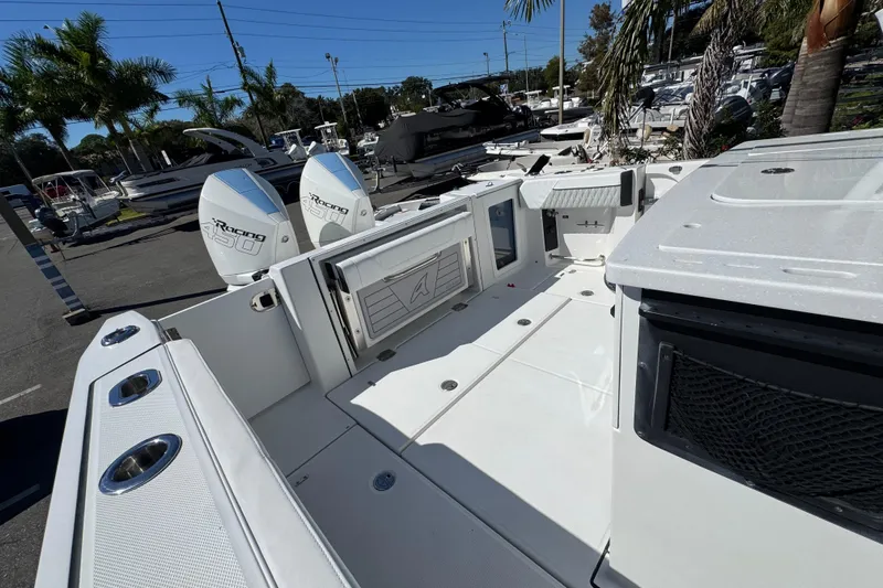  Yacht Photos Pics 2021 Blackfin 332 CC boat with twin outboard engines in a marina setting.