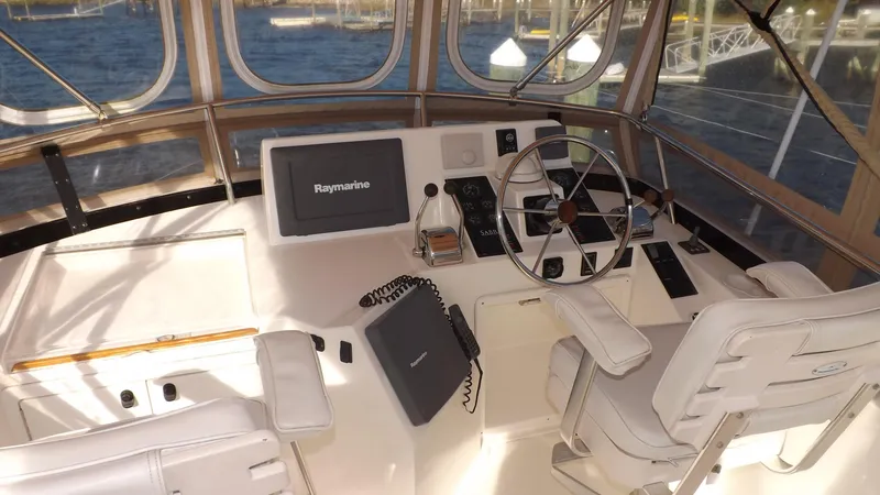  Yacht Photos Pics 2003 Sabre 36 Flybridge helm with Raymarine navigation system and dual captain chairs.