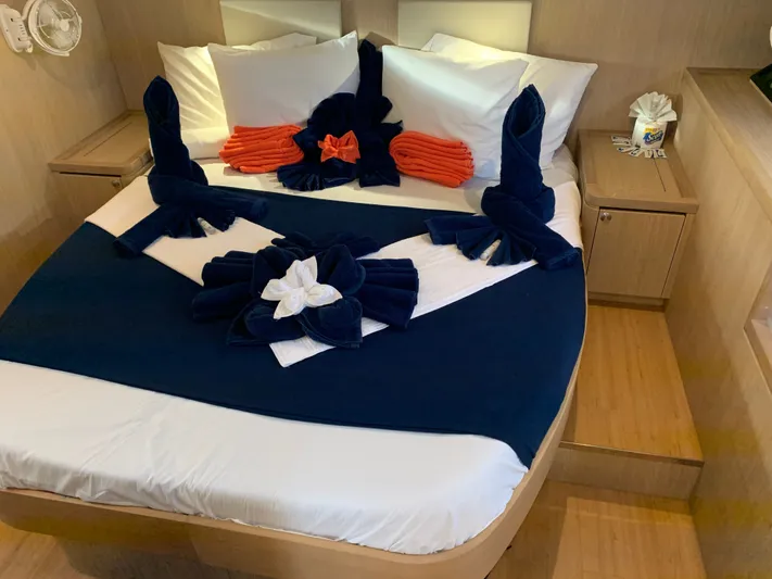 Life Settling Yacht Photos Pics Luxurious cabin of 2022 Aquila 44 Yacht with artfully folded towels.
