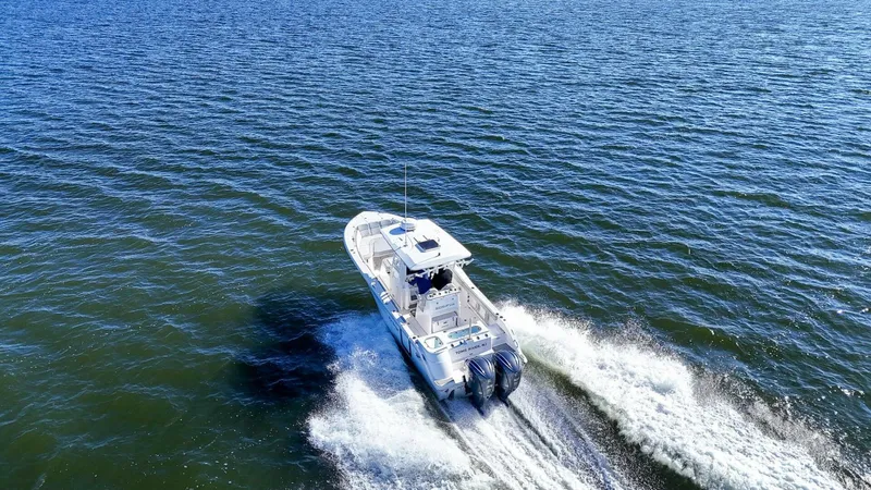  Yacht Photos Pics 2022 Sea Fox 288 Commander boat cruising on open water, creating a wake.