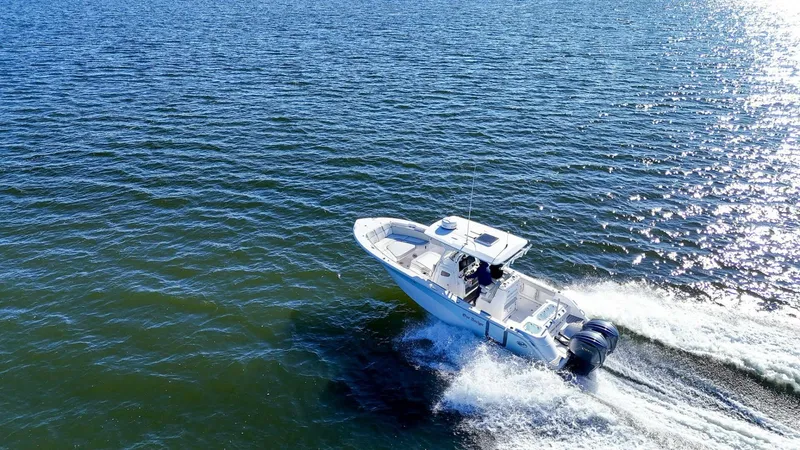 Yacht Photos Pics 2022 Sea Fox 288 Commander cruising on open water, aerial view.