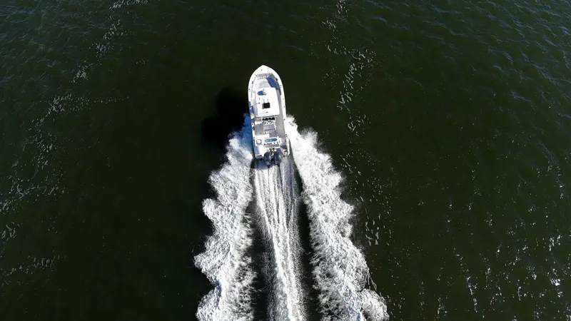  Yacht Photos Pics Aerial view of 2022 Sea Fox 288 Commander boat cruising on open water.